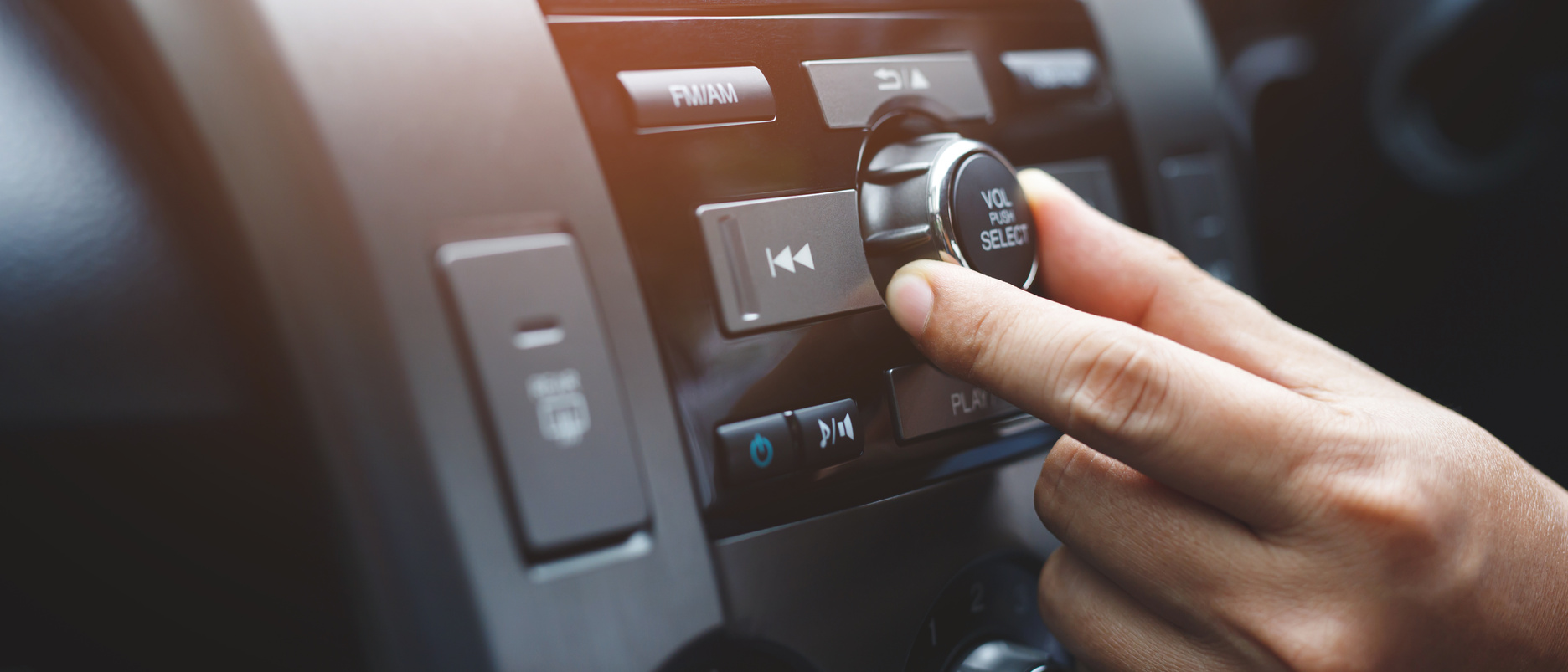 close up hand open car radio listening. Car Driver changing turning button Radio